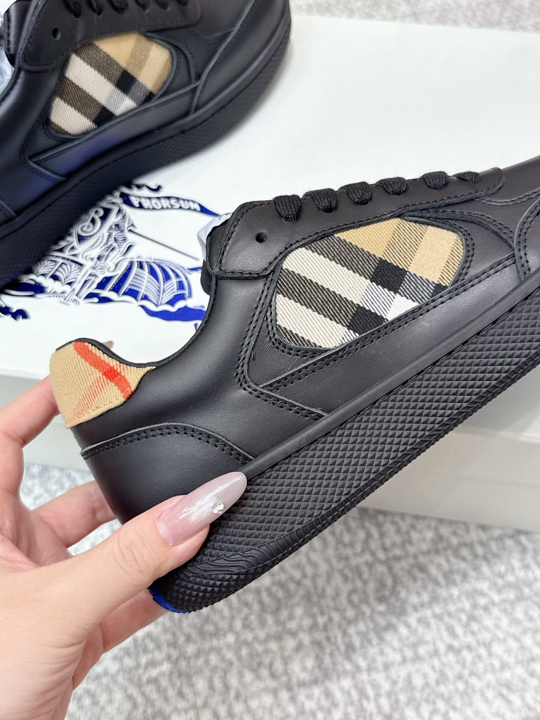 Burberry black sneaker with check-panel quarter and textured sole tread