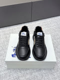 Burberry black leather sneakers with lace-up front and check-panel side