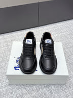Burberry black leather sneakers with lace-up front and check-panel side