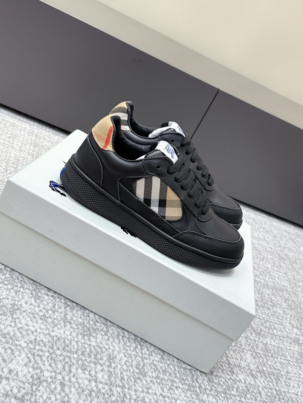 Burberry black sneakers with check-panel side stripe, textured sole, lace-up