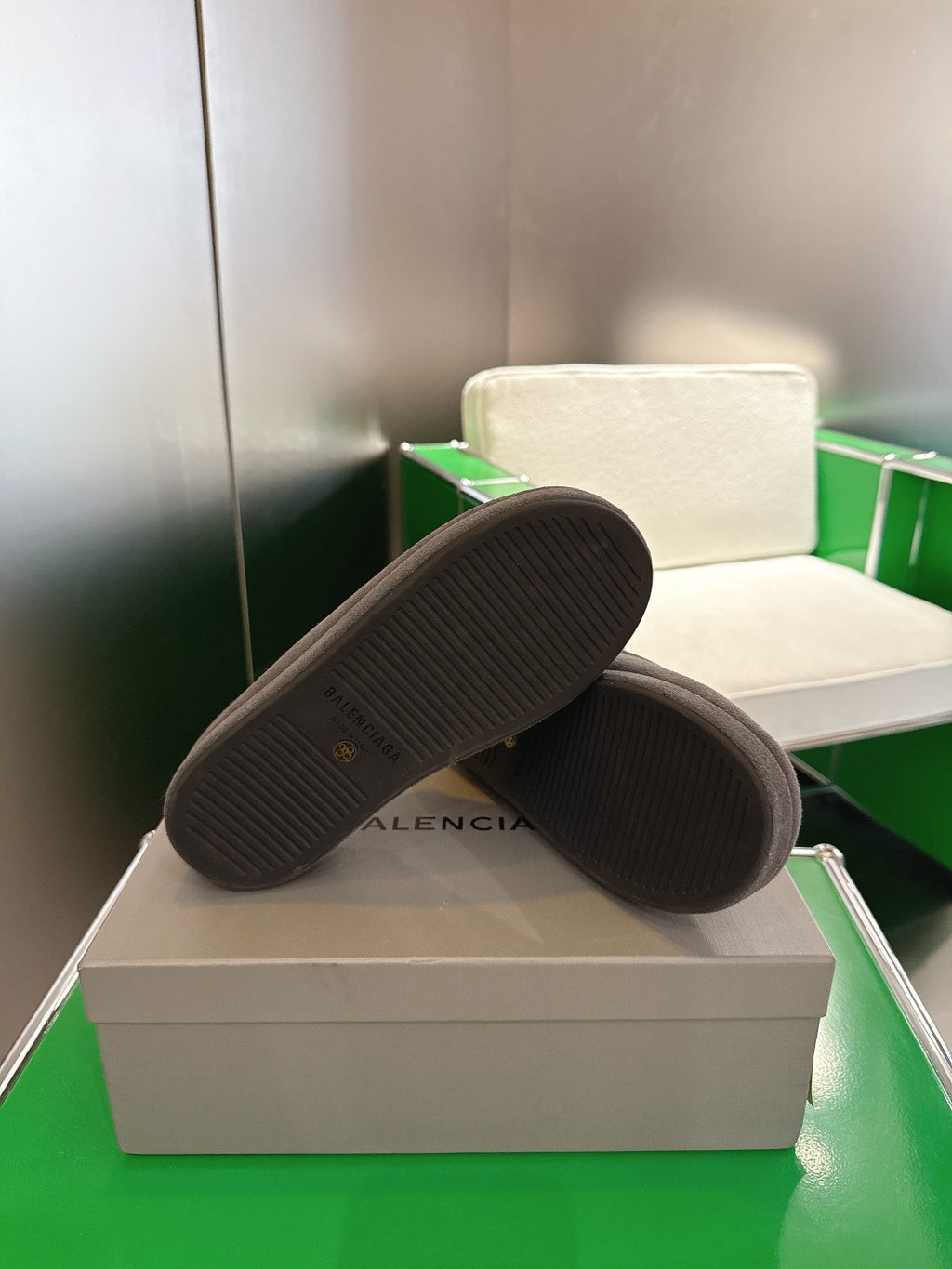 Dark gray suede slide sandal bottoms with textured black rubber sole