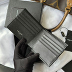 Black textured wallet bag with card slots and long strap