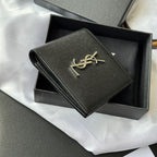 Black textured small wallet bag with gold YSL logo and side zipper edge