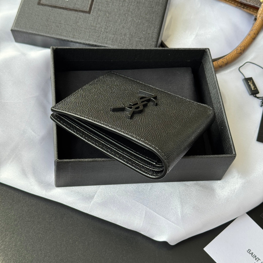 Small textured leather wallet with YSL logo and folded profile in open box