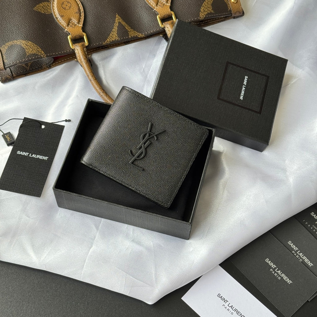 Small textured leather card holder wallet with YSL logo, shown in open gift box