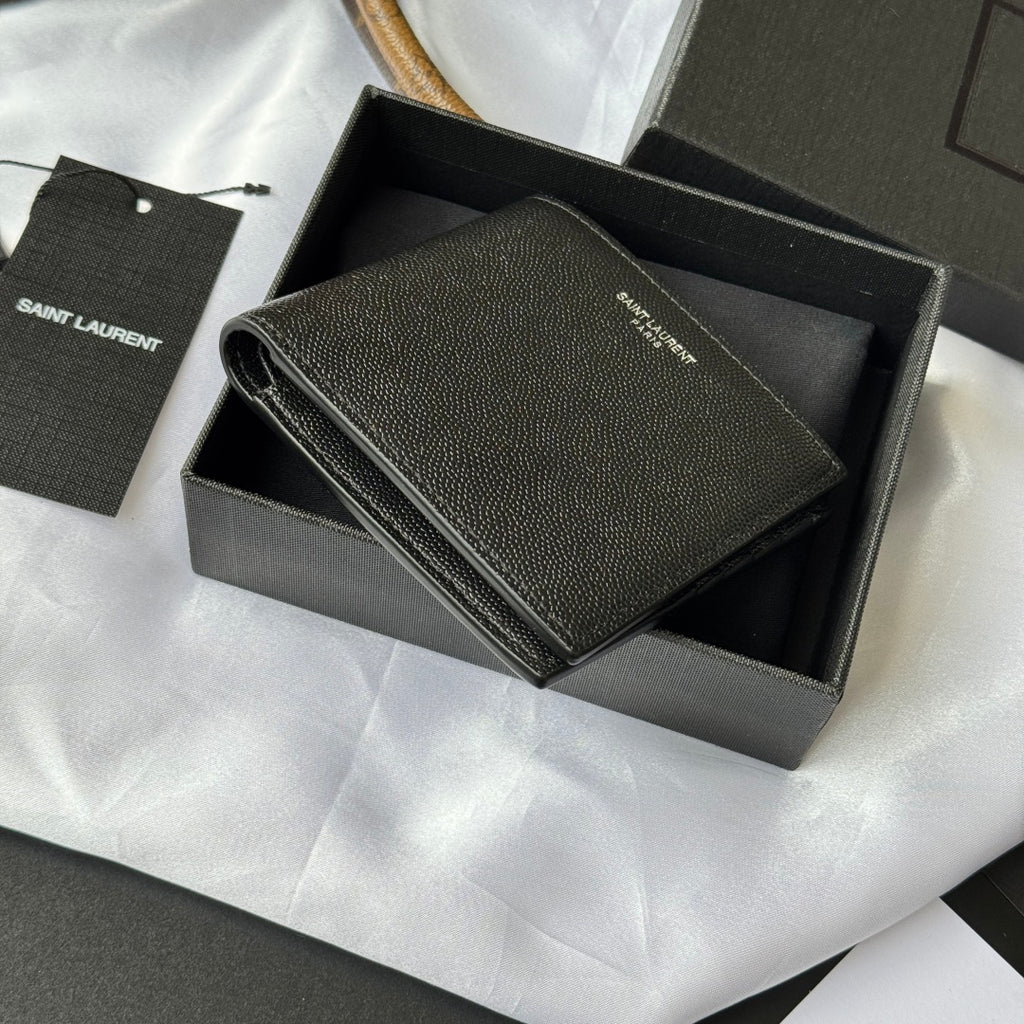 Small bag with top flap open, textured dark leather and card compartments