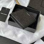 Small bag with top flap open, textured dark leather and card compartments