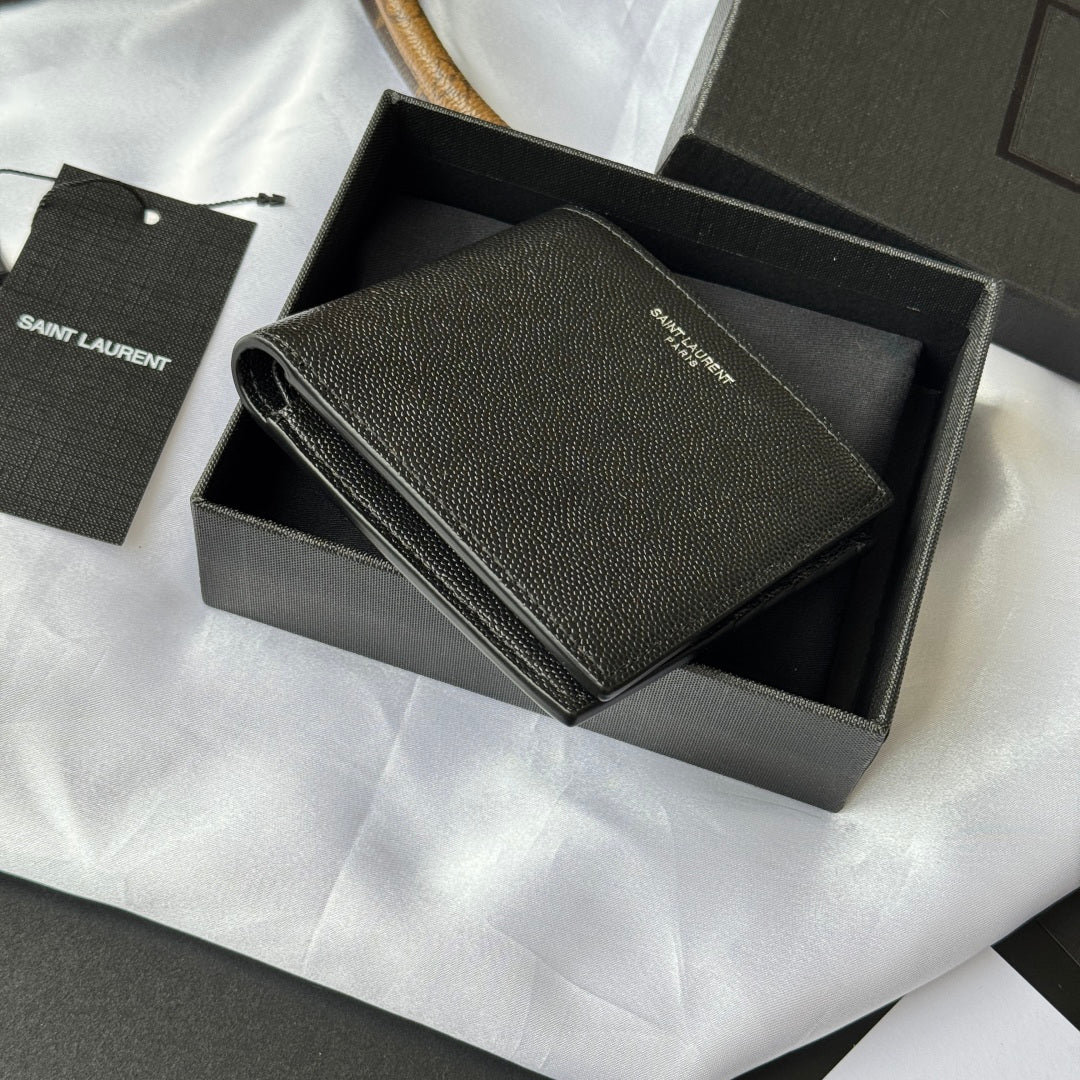 Small bag with top flap open, textured dark leather and card compartments