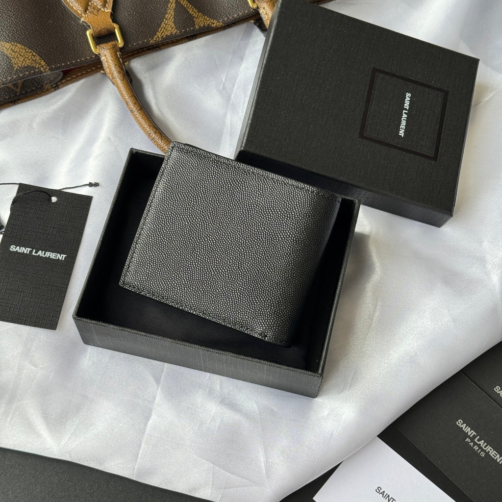 Small leather bag with textured surface and YSL logo, set in a box
