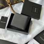 Small leather bag with textured surface and YSL logo, set in a box