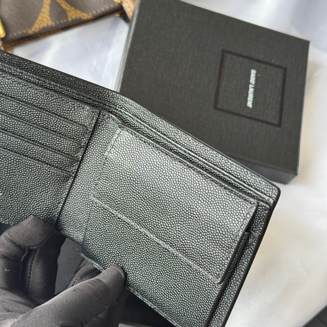 Small leather bag interior view with card slots and stitched fold edge