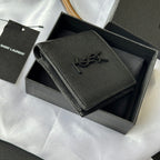 Small leather bag with textured exterior, YSL logo, and side zipper trim