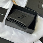 Small leather bag with YSL logo front and curved double-edge zipper detail