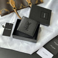 Small leather bag with textured finish and YSL logo plaque on the front