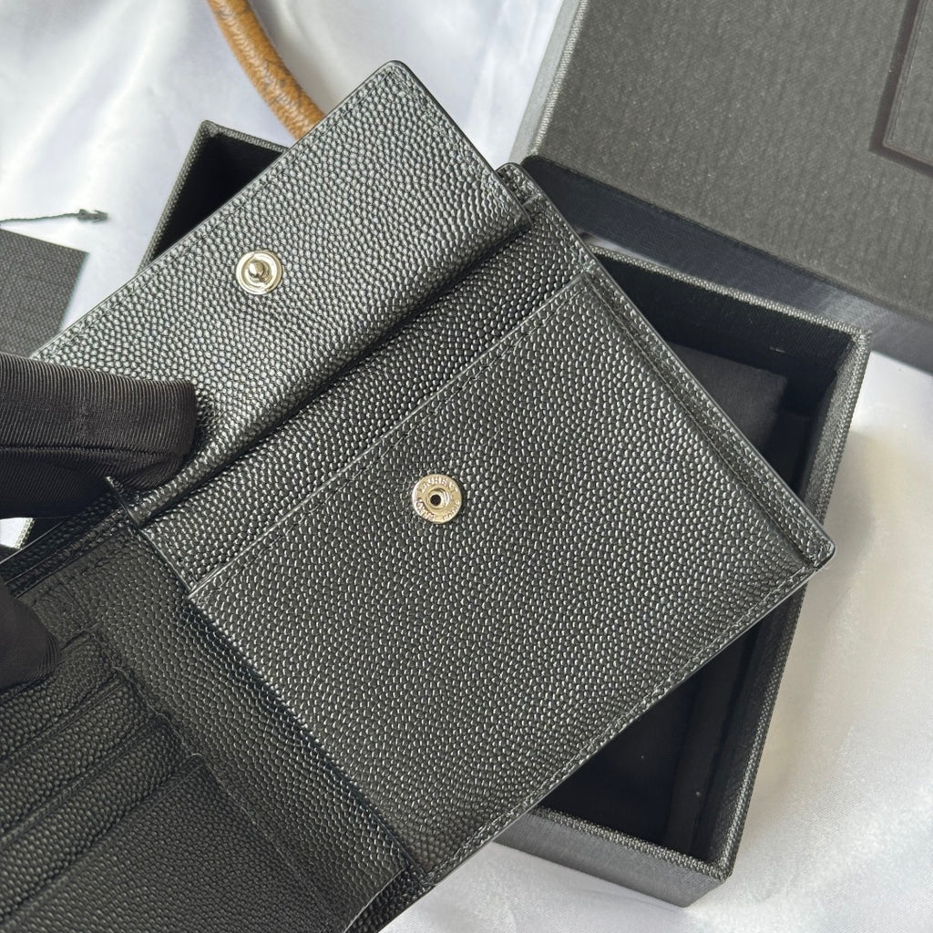 Textured small bag with flap and gold snap, shown open, in dark gray