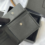 Textured small bag with flap and gold snap, shown open, in dark gray