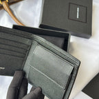 Black textured leather card holder close-up of folded compartments
