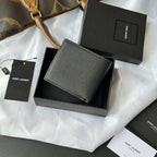 Black textured small leather bag in box, flat front panel
