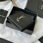 Black textured small leather bag with gold YSL signature on front flap