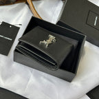 Black textured small leather bag with gold YSL clasp, open view