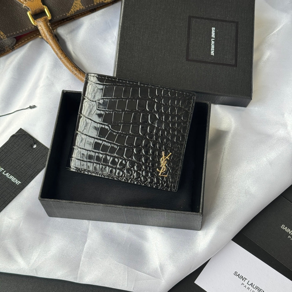 Small crocodile-embossed leather card case with gold YSL logo, front view