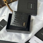 Small crocodile-embossed leather card case with gold YSL logo, front view