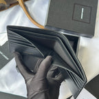 Small leather card case interior with card slots, shown open and folded flat