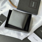 Small bag wallet with light gray exterior, stitched border, and gold YSL-style logo