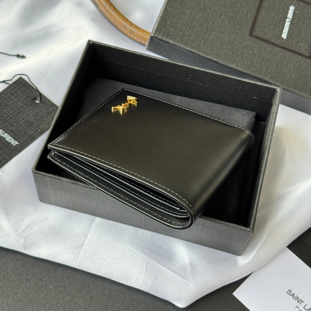 Small bag wallet open, showing layered card compartments with gold logo detail