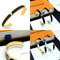 Louis Vuitton hoop bracelet set, black enamel with gold-tone and silver-tone accents