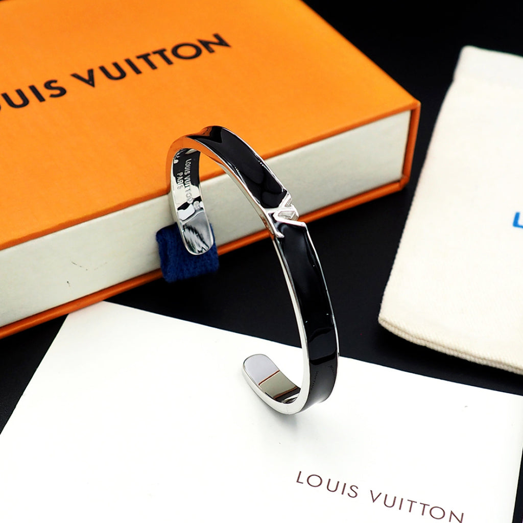 Louis Vuitton bracelet with black enamel band and silver-tone V clasp