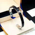 Louis Vuitton bracelet with black enamel band and silver-tone clasp in display box