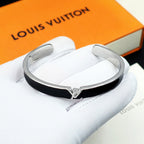 Louis Vuitton cuff bracelet with black enamel center and silver-tone clasp