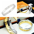 Louis Vuitton engraved silver cuff bracelet with repeating monogram-style pattern