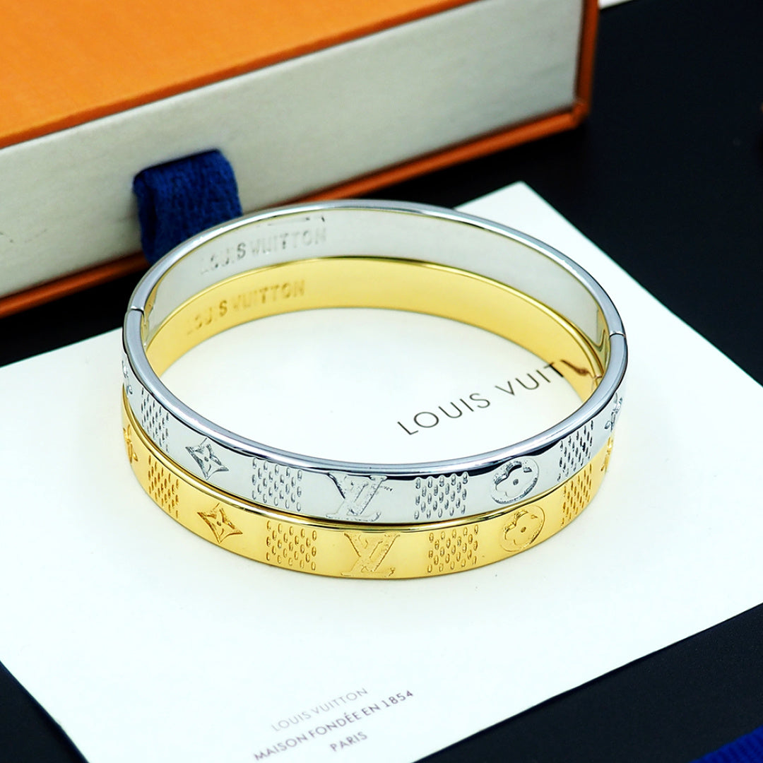 Louis Vuitton two-tone cuff bracelet with gold and silver engraved pattern