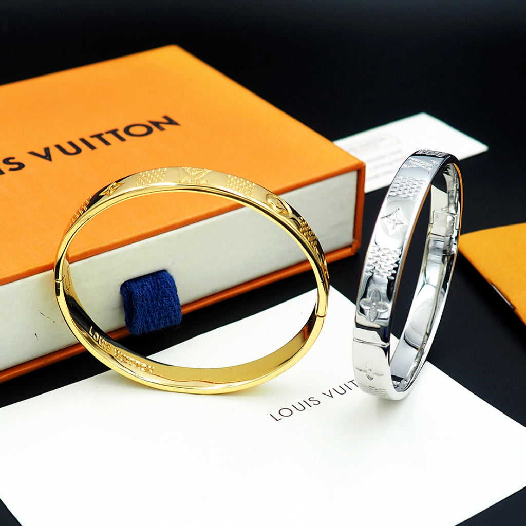 Louis Vuitton gold tone bangle bracelet with engraved texture