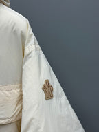 Light beige jacket sleeve with cactus appliqué patch