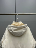 Light beige hooded jacket back view with gathered hood and seam detailing
