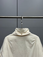 Cream long puffer jacket with high collar and zip front