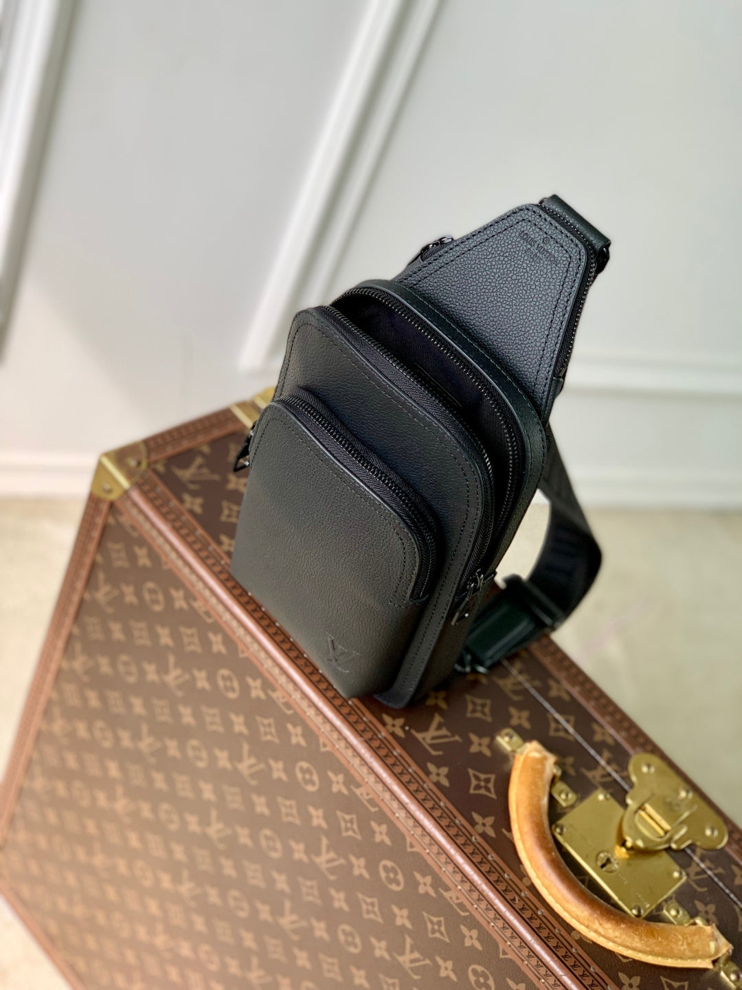 Louis Vuitton dark gray leather crossbody bag with front zip pocket and shoulder strap