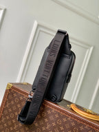 Louis Vuitton dark gray leather crossbody bag with adjustable strap and side zip