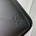 Dark gray pebbled leather corner with stitched edge and embossed logo detail