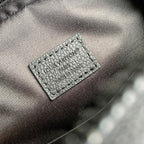 Embossed logo patch on gray leather lining with textured grain
