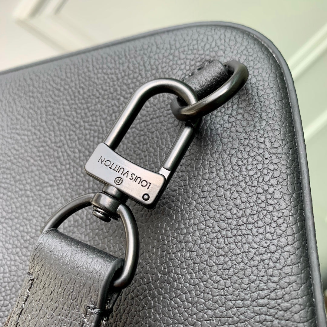 Louis Vuitton dark gray leather bag with metal top rings and small logo lock tag