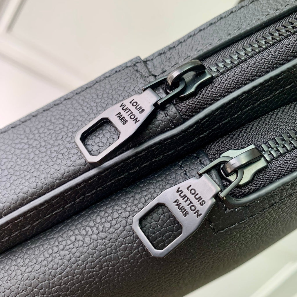 Louis Vuitton dark gray leather bag with two zip pulls and logo tag hardware