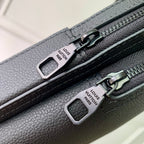 Louis Vuitton dark gray leather bag with two zip pulls and logo tag hardware