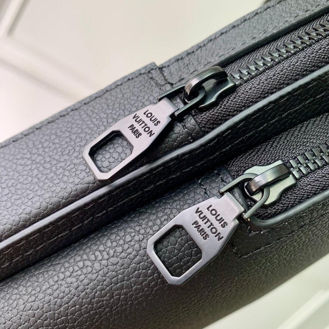 Louis Vuitton dark gray leather bag with two zip pulls and logo tag hardware