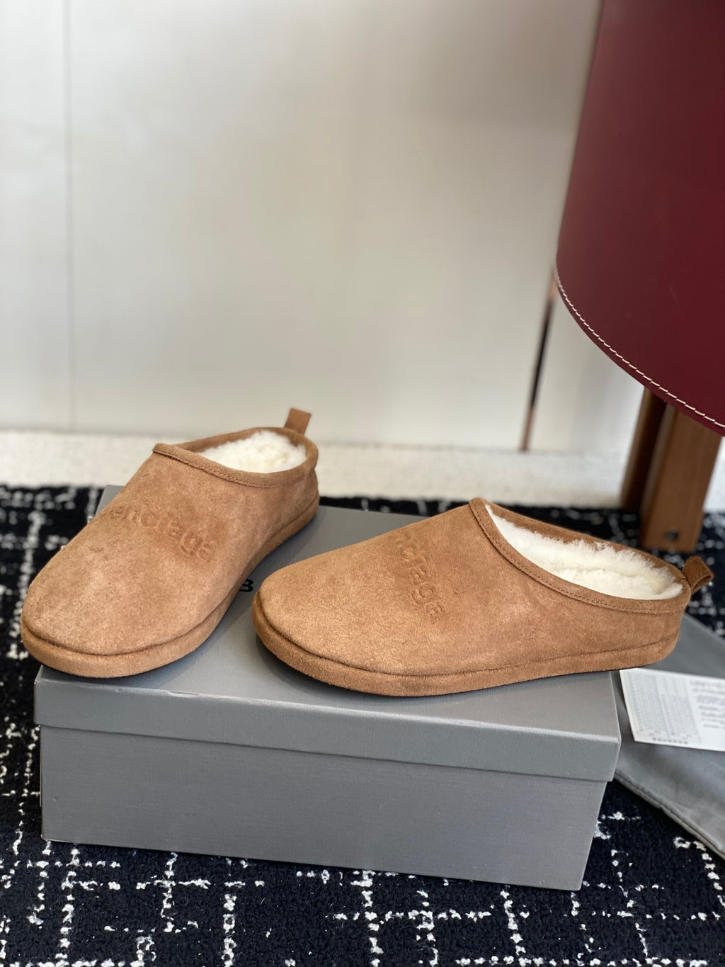Balenciaga tan suede shearling-lined mules, pair shown from side angle