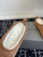 Balenciaga tan suede mules with shearling lining, close-up of opening