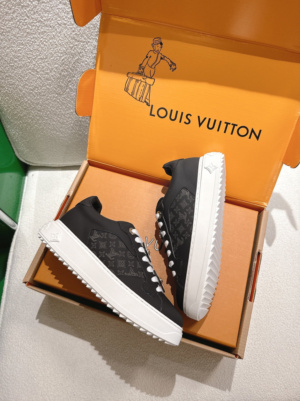 Louis Vuitton high-traction sneakers, black monogram uppers, white zigzag sole